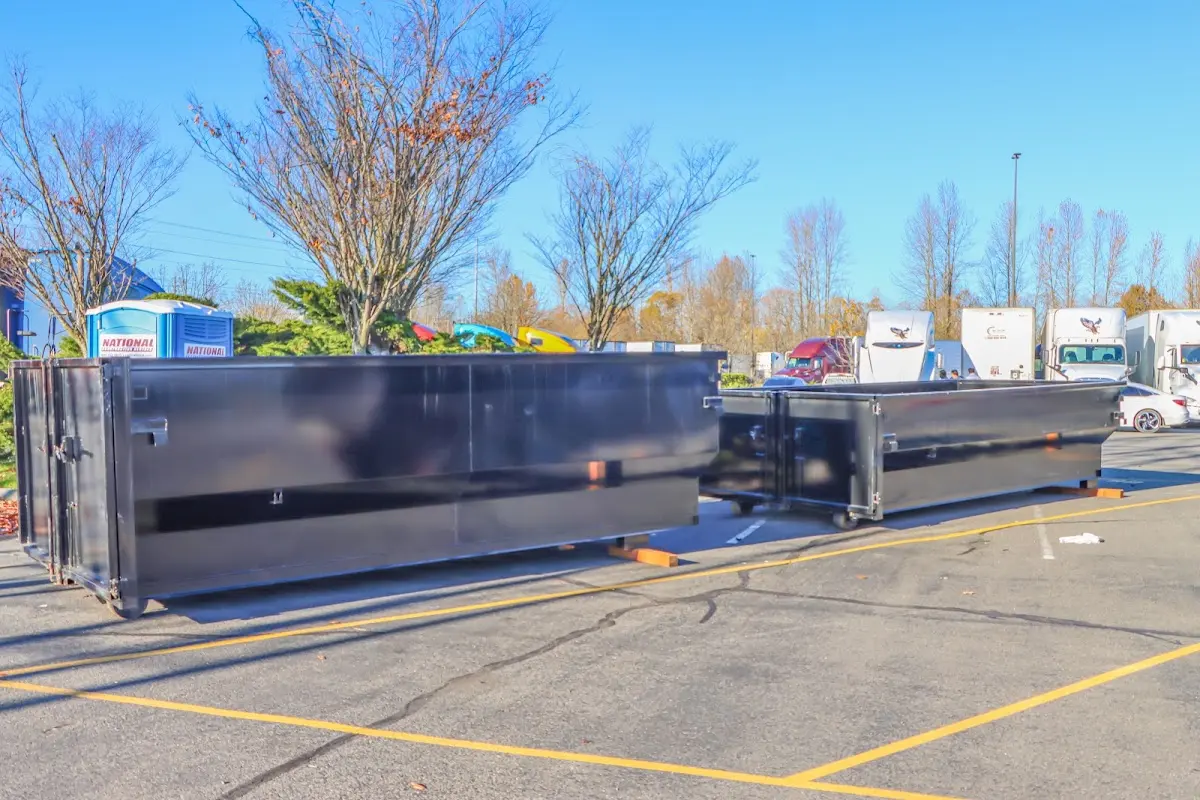 Professional dumpster rental service with roll-off container on residential driveway in Leon Valley